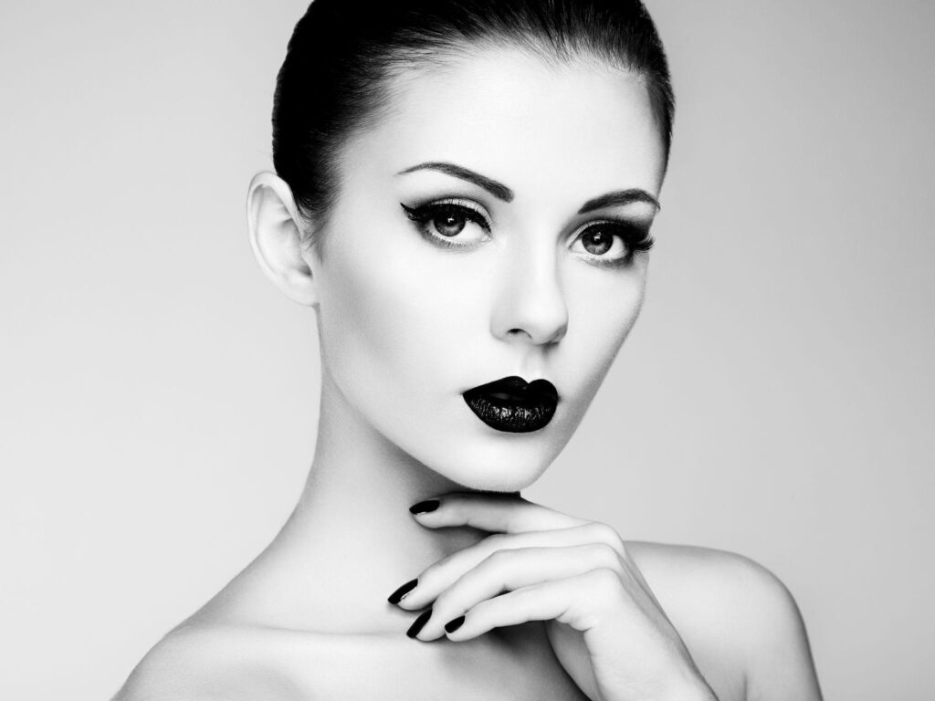 FASHION AS A FORM OF SELF EXPRESSION Black and white beauty portrait of a fashion model with bold makeup and elegant style, showcasing Fashion as a Form of Self-Expression.