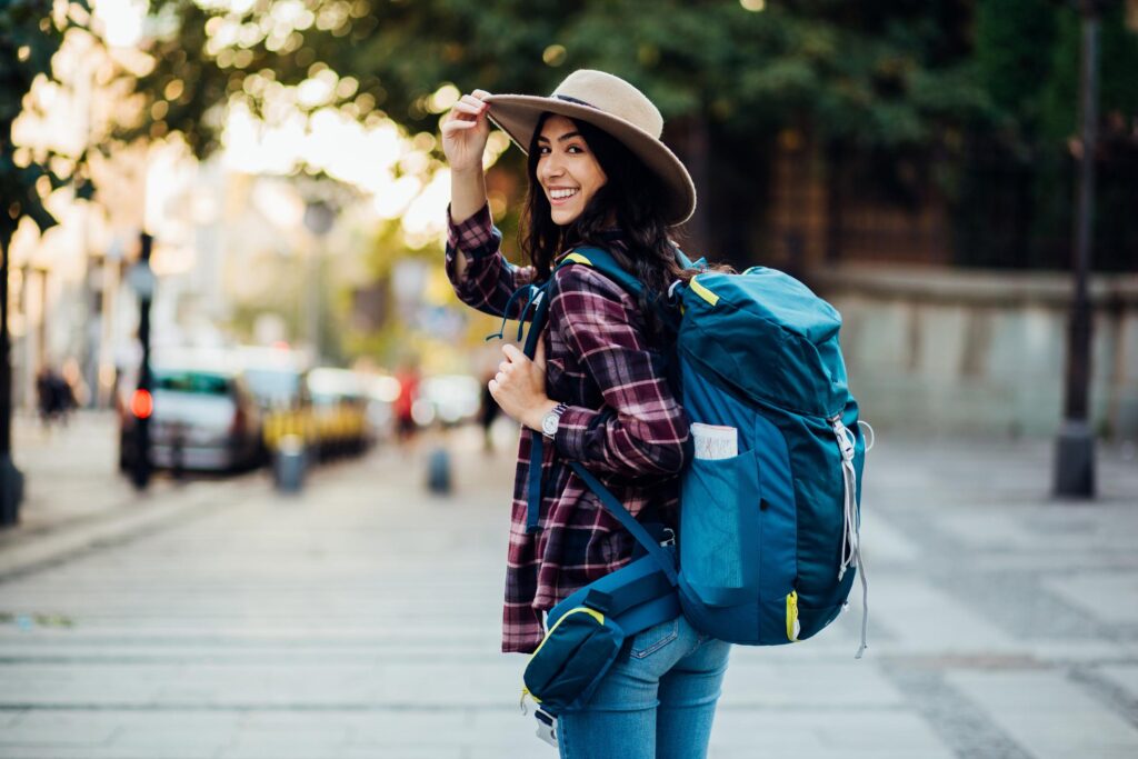 TRAVEL AS A FORM OF SELF DISCOVERY WOMAN WITH BACKPACK EXPLORING A NEW DESTINATION – TRAVEL AS A FORM OF SELF-DISCOVERY